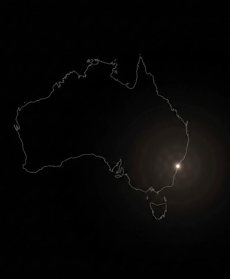 An outline of Australia on black, with one point of light on Sydney and rings spreading out from it